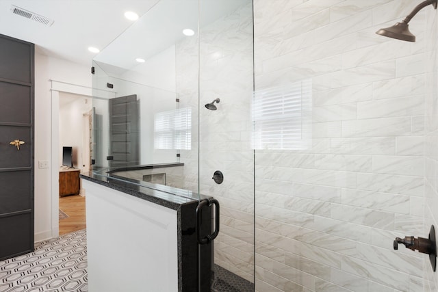 bathroom featuring a stall shower, recessed lighting, and visible vents