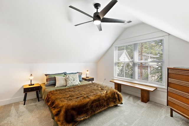 carpeted bedroom featuring ceiling fan, lofted ceiling, baseboards, and visible vents
