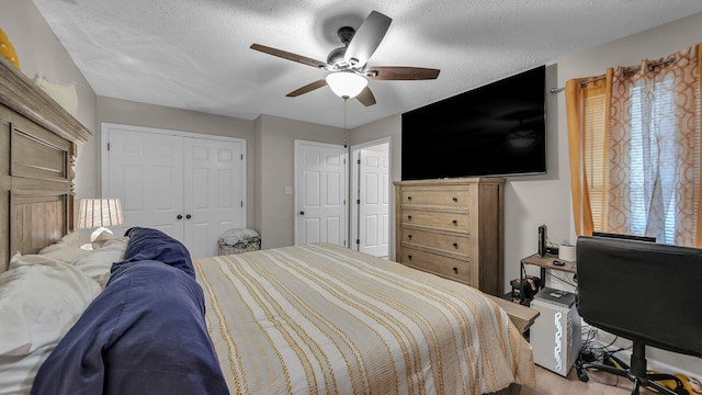 bedroom with a textured ceiling, a closet, and a ceiling fan
