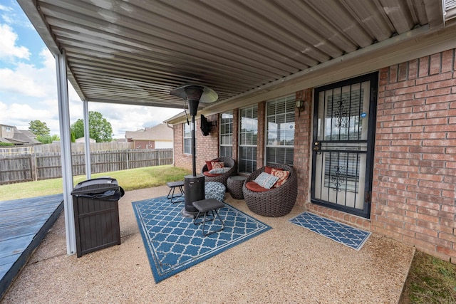 view of patio with fence and a wooden deck