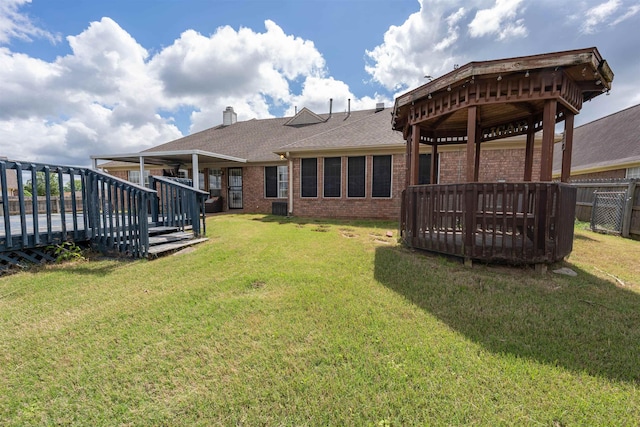 view of yard featuring a deck and fence