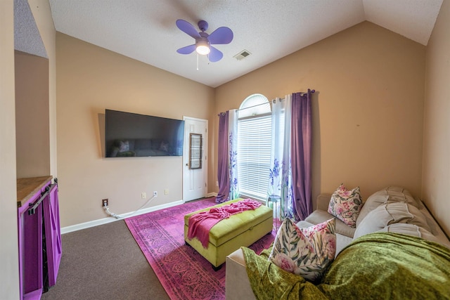 living room with a ceiling fan, baseboards, carpet flooring, visible vents, and vaulted ceiling