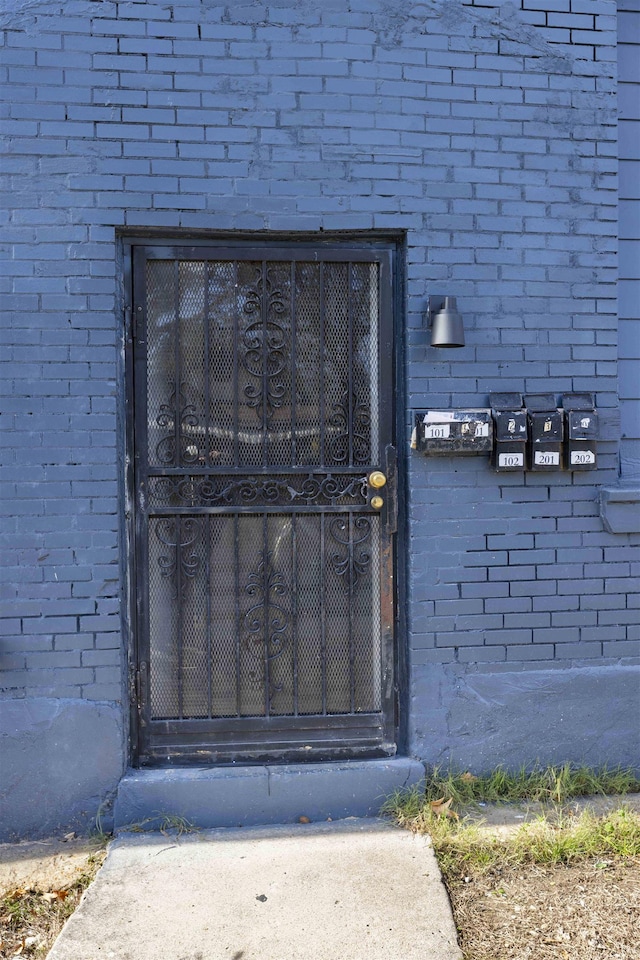 993 Oakview St, Memphis, TN 38114 - doorway to property featuring brick siding