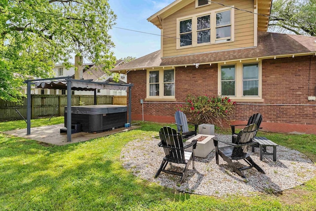 158 N Willett St, Memphis, TN 38104 - rear view of property featuring a hot tub, a shingled roof, brick siding, and a fenced backyard