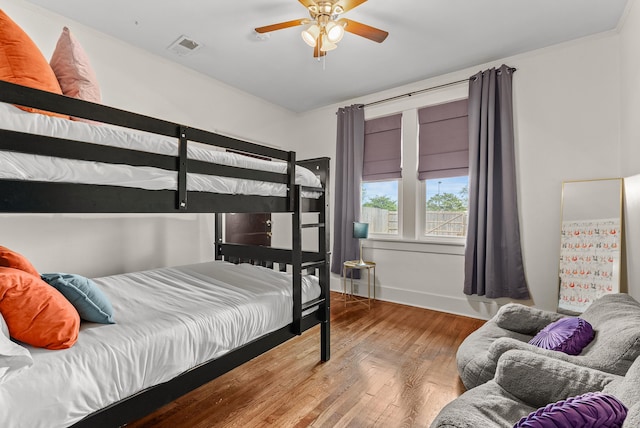 158 N Willett St, Memphis, TN 38104 - bedroom featuring baseboards, ceiling fan, visible vents, and wood finished floors