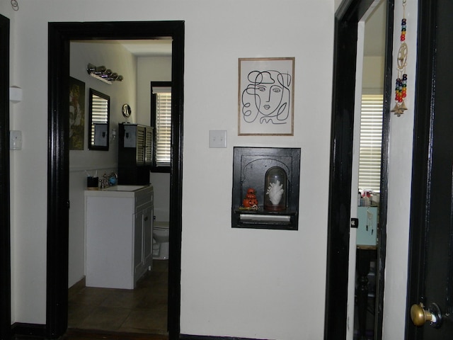 496 Eastern Dr SW, Memphis, TN 38122 - hall featuring a sink and tile patterned flooring