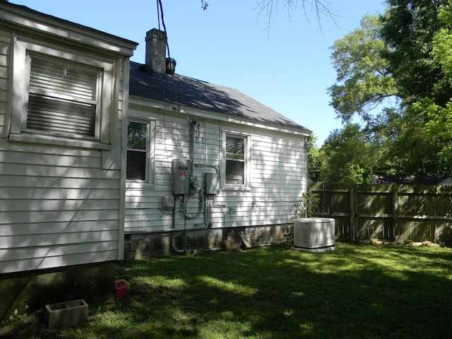 496 Eastern Dr SW, Memphis, TN 38122 - view of home's exterior with cooling unit and a chimney