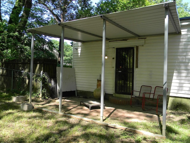 496 Eastern Dr SW, Memphis, TN 38122 - doorway to property featuring fence and a patio area