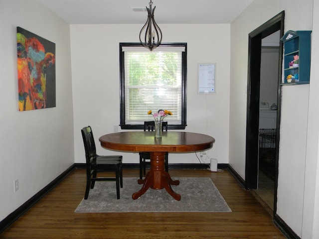 496 Eastern Dr SW, Memphis, TN 38122 - dining area featuring baseboards, visible vents, and wood finished floors