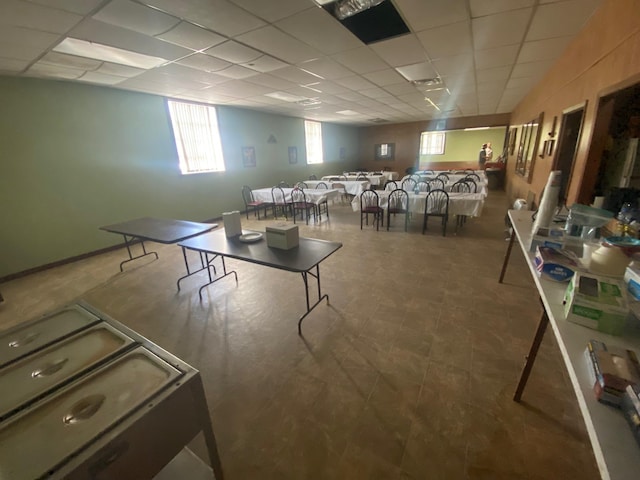 game room with a drop ceiling