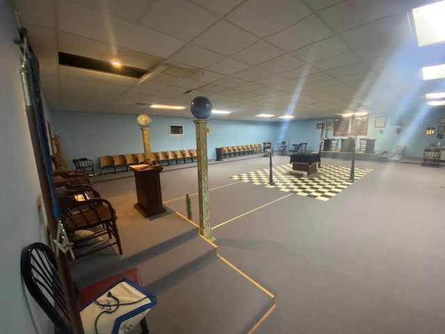 below grade area with a drop ceiling