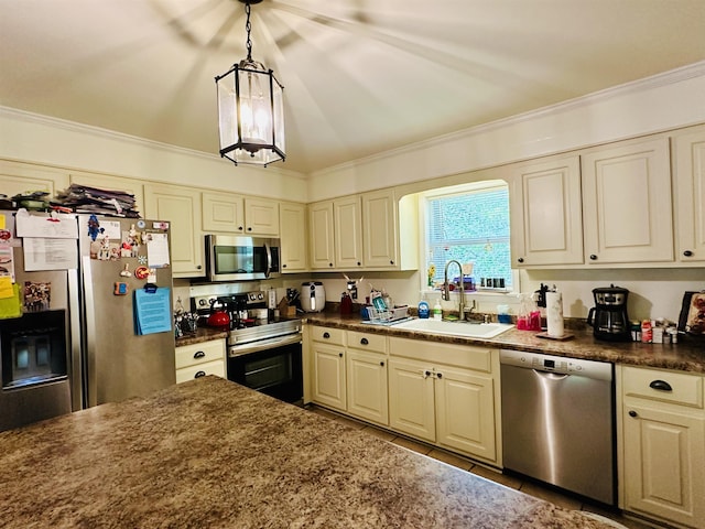 kitchen featuring ornamental molding, a sink, tile patterned floors, dark countertops, and stainless steel appliances