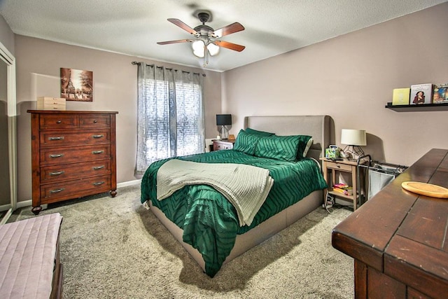 bedroom with carpet, baseboards, and ceiling fan