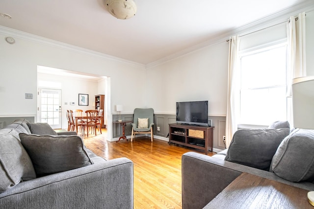 1851 Walker Ave, Memphis, TN 38114 - living area with light wood finished floors, wainscoting, and ornamental molding