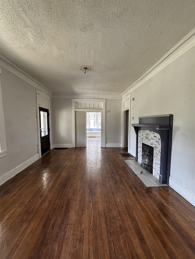 unfurnished living room featuring crown molding, a fireplace with flush hearth, and a textured ceiling