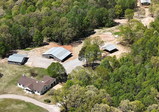 drone / aerial view featuring a view of trees