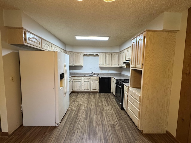 kitchen with range with gas stovetop, black dishwasher, dark wood finished floors, white refrigerator with ice dispenser, and a sink