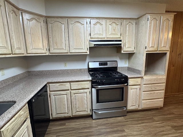 kitchen featuring stainless steel range with gas cooktop, under cabinet range hood, light countertops, and dishwasher