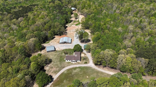 aerial view featuring a wooded view