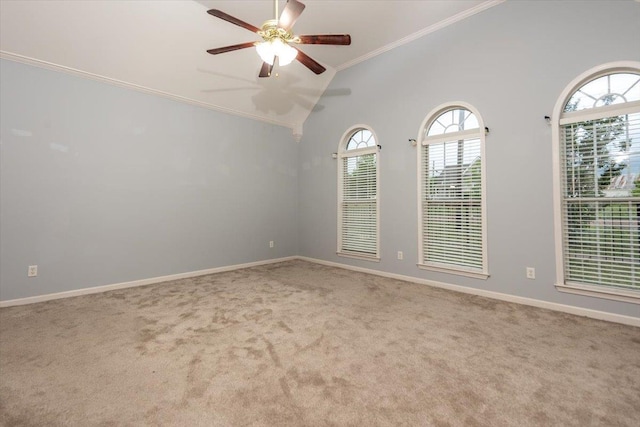 unfurnished room featuring carpet floors, baseboards, ceiling fan, lofted ceiling, and ornamental molding