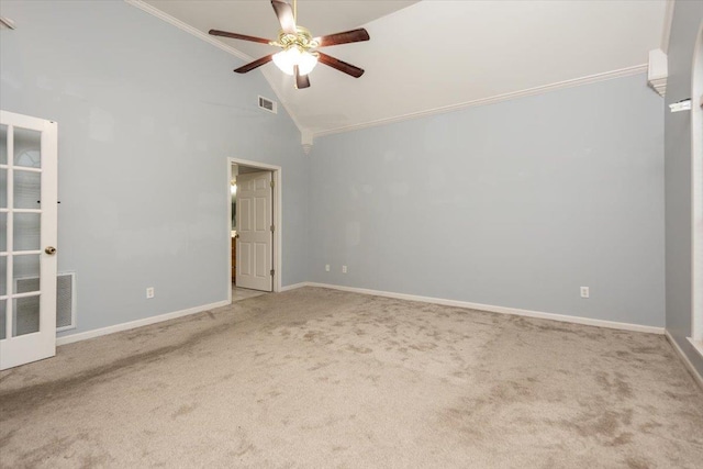 spare room featuring carpet flooring, visible vents, a ceiling fan, and ornamental molding
