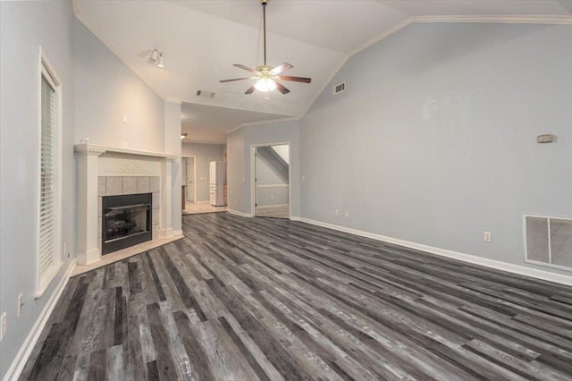 unfurnished living room featuring a ceiling fan, visible vents, and lofted ceiling