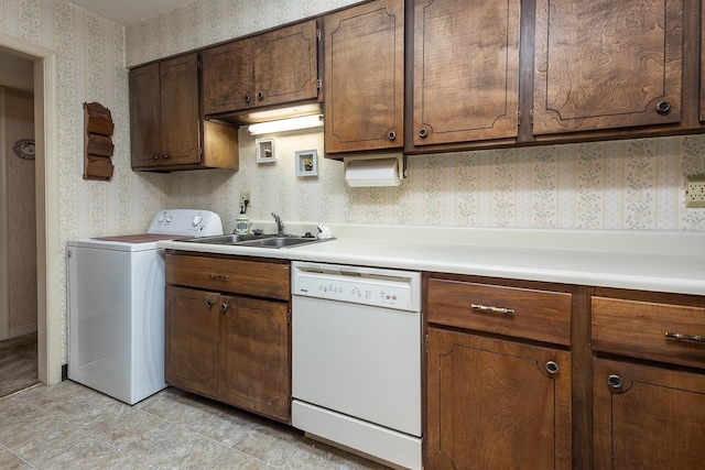 5676 Quince Rd Unit 7, Memphis, TN 38119 - kitchen with a sink, wallpapered walls, light countertops, washer / clothes dryer, and white dishwasher