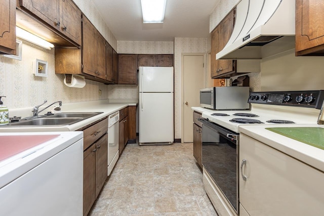 5676 Quince Rd Unit 7, Memphis, TN 38119 - kitchen with under cabinet range hood, light countertops, a sink, and white appliances