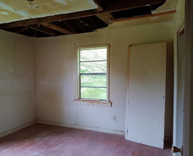 unfurnished room featuring wood-type flooring