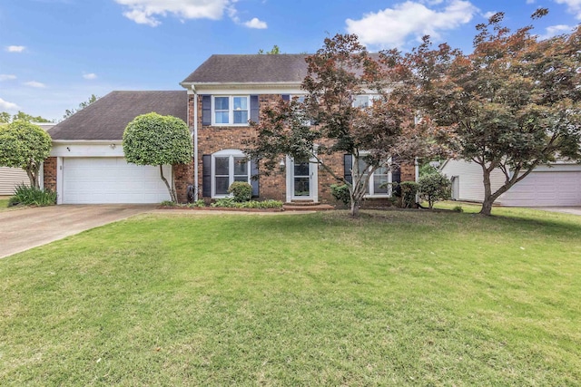 colonial-style house with brick siding, an attached garage, concrete driveway, a front lawn, and a shingled roof