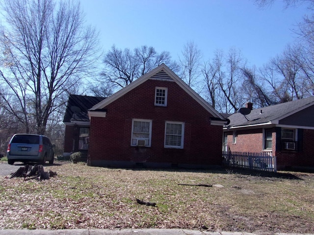 view of property exterior with brick siding