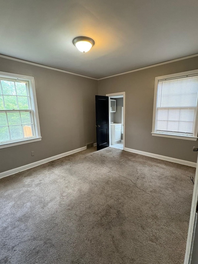 3274 Crete Ave, Memphis, TN 38111 - empty room with crown molding, healthy amount of natural light, carpet, and baseboards