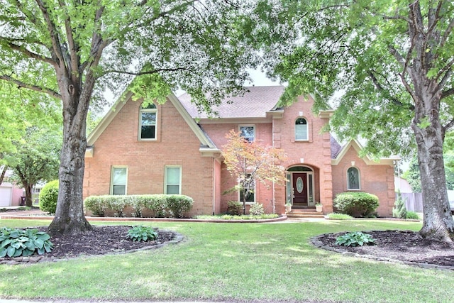 1599 John Ridge Dr, Collierville, TN 38017 - tudor house featuring brick siding and a front yard