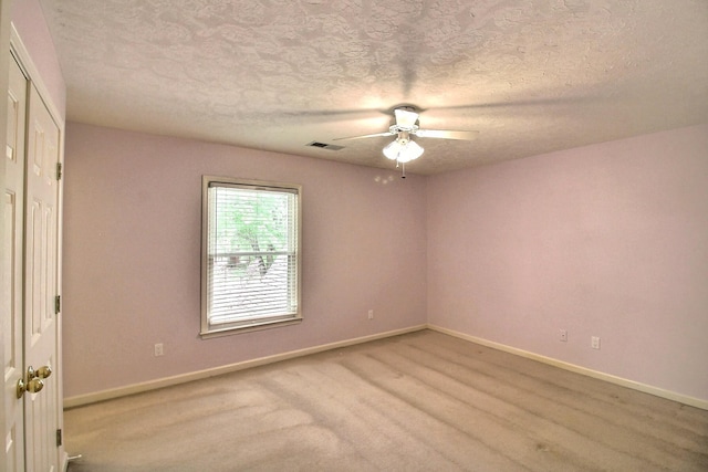 1599 John Ridge Dr, Collierville, TN 38017 - unfurnished room with a ceiling fan, baseboards, and a textured ceiling