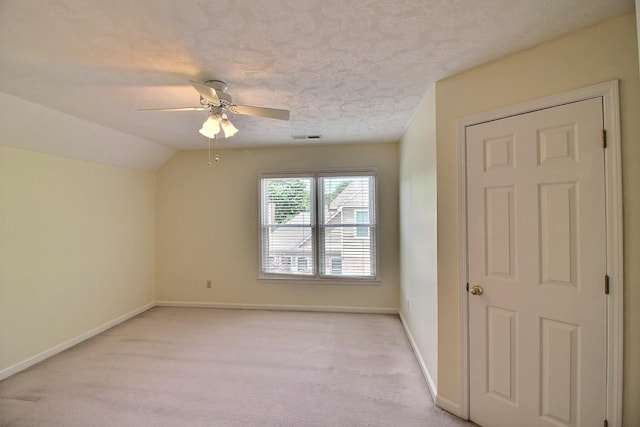 1599 John Ridge Dr, Collierville, TN 38017 - unfurnished room with baseboards, a ceiling fan, light colored carpet, a textured ceiling, and lofted ceiling