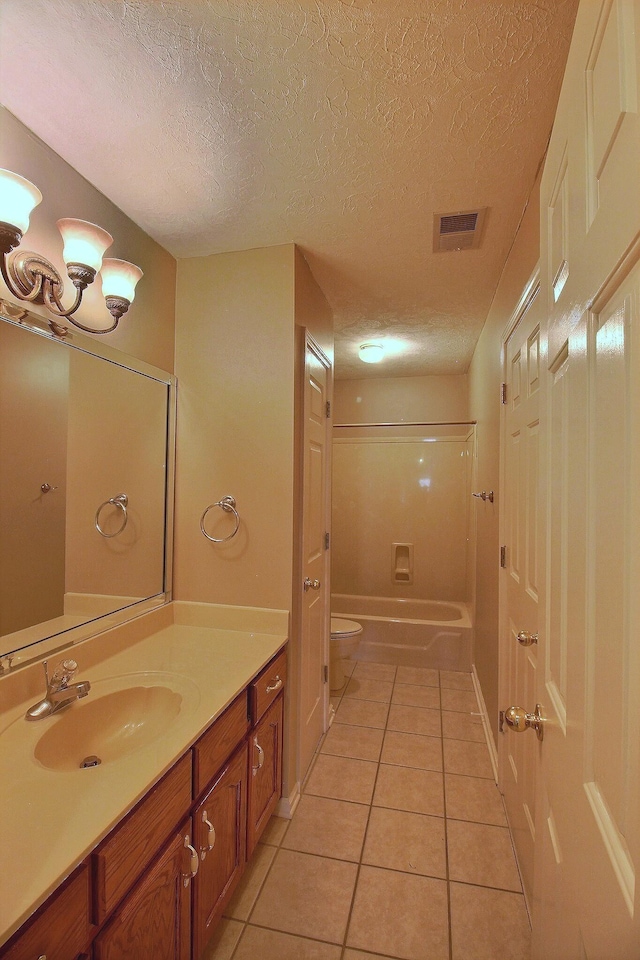 1599 John Ridge Dr, Collierville, TN 38017 - bathroom with tile patterned floors, a textured ceiling, toilet, vanity, and tub / shower combination