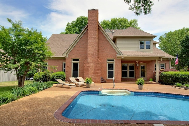 1599 John Ridge Dr, Collierville, TN 38017 - rear view of property featuring a patio area, a chimney, brick siding, and roof with shingles