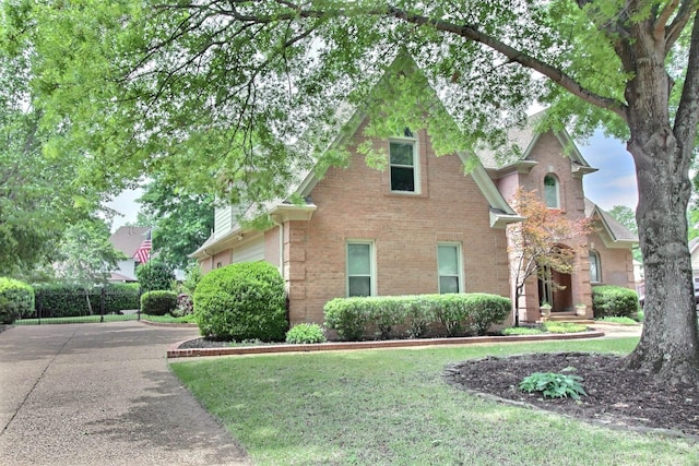 1599 John Ridge Dr, Collierville, TN 38017 - view of front facade with brick siding, driveway, and a front lawn