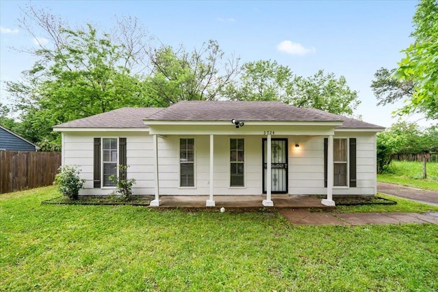 ranch-style home with covered porch and roof with shingles