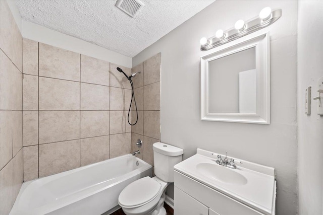 bathroom featuring a textured ceiling, toilet, vanity, and bathtub / shower combination