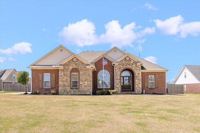 single story home featuring brick siding and stone siding