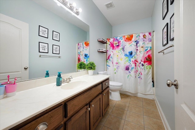 bathroom featuring vanity, toilet, tile patterned floors, and shower / bath combination with curtain