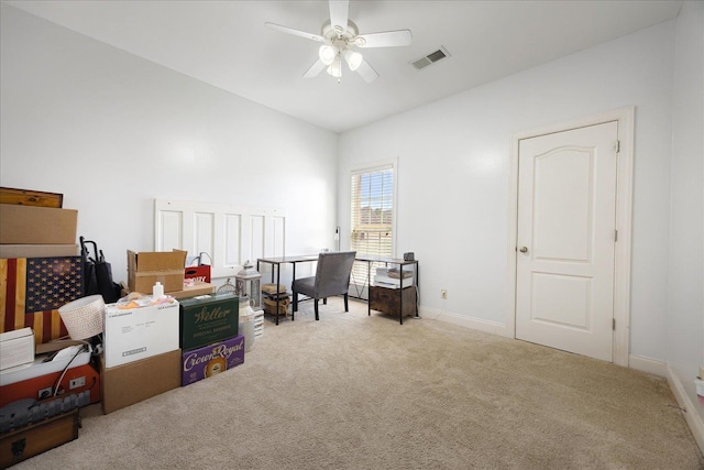 office area with carpet floors, a ceiling fan, and baseboards