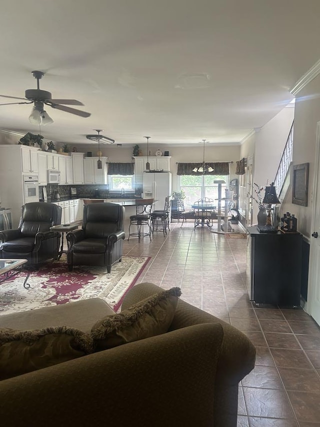 732 Catesby Cv, Collierville, TN 38017 - living room featuring a ceiling fan and ornamental molding