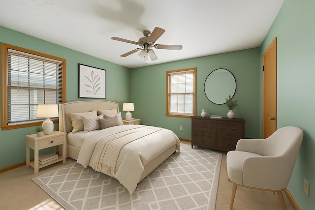 1844 Myrna Ln, Memphis, TN 38117 - bedroom with baseboards, ceiling fan, and light carpet