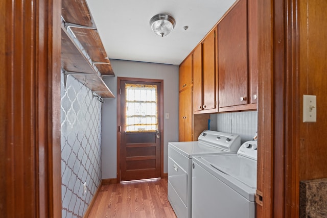 1844 Myrna Ln, Memphis, TN 38117 - clothes washing area with cabinet space, separate washer and dryer, light wood-style floors, and baseboards