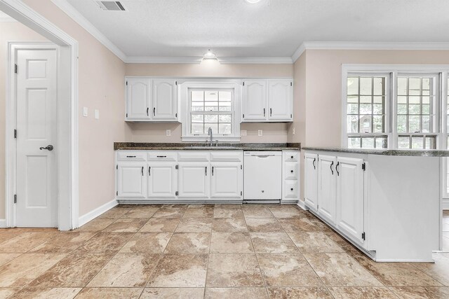 345 Locust Grove Grv, Memphis, TN 38018 - kitchen with white dishwasher, a sink, white cabinets, crown molding, and a peninsula