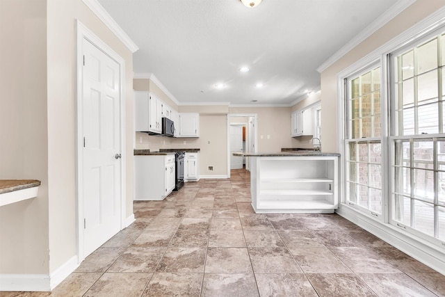 345 Locust Grove Grv, Memphis, TN 38018 - kitchen with dark countertops, baseboards, ornamental molding, stainless steel gas stove, and black microwave