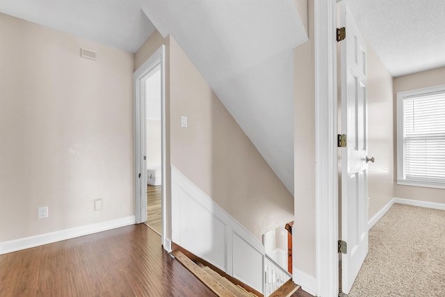 345 Locust Grove Grv, Memphis, TN 38018 - corridor featuring baseboards, wood finished floors, and an upstairs landing