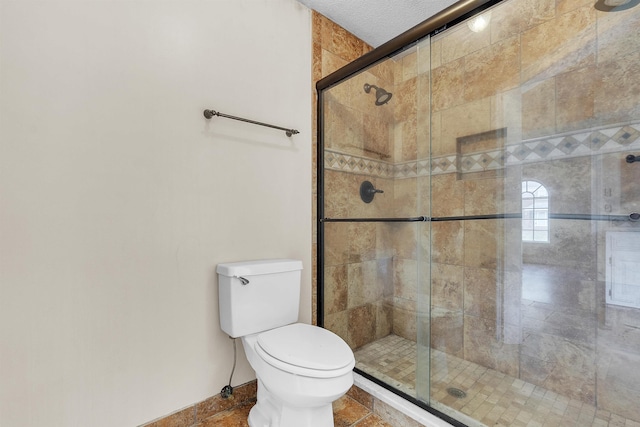 345 Locust Grove Grv, Memphis, TN 38018 - bathroom with a shower stall, toilet, and baseboards
